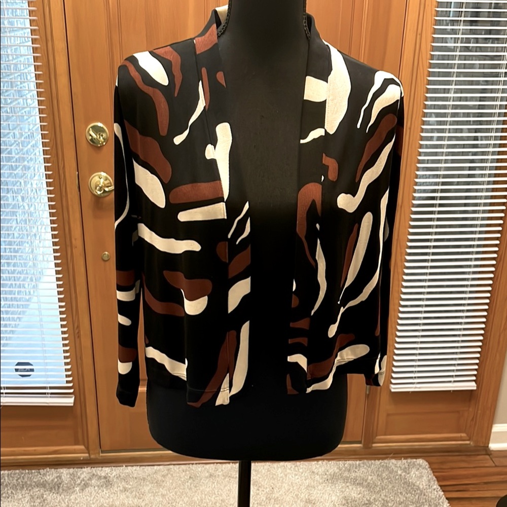 Never worn Chico corp cardigan. Beige, black, brown and tan.